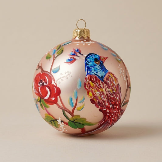 Multicolored bird ball and flowers on pink