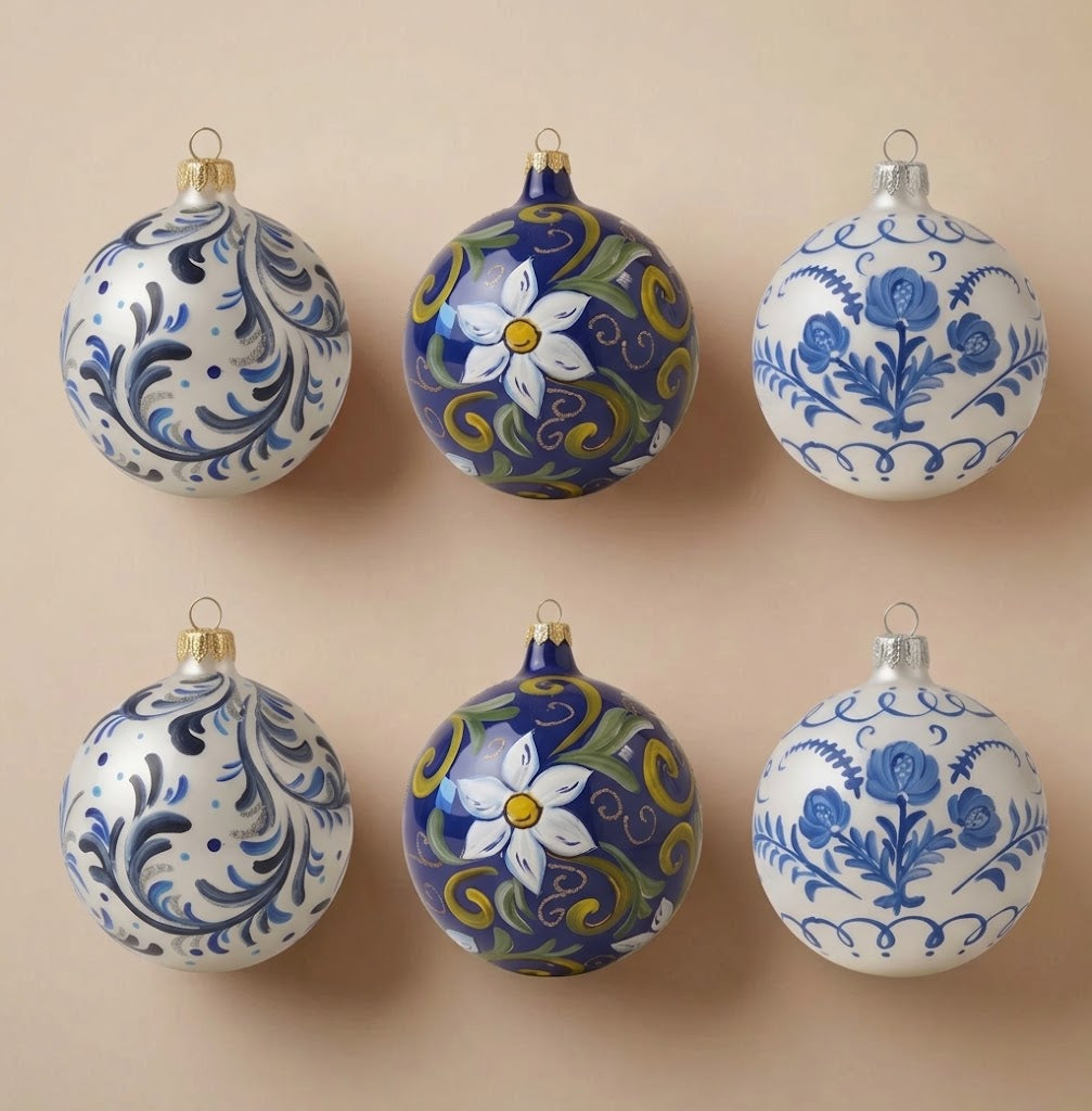 Set of 6 blue maiolica Christmas ornaments: two with blue scrolls, two with a white flower on blue, two with blue roses