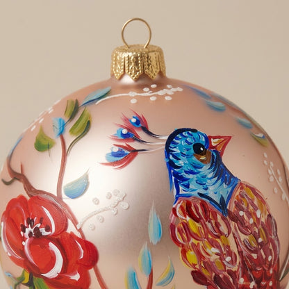 Multicolored bird ball and flowers on pink