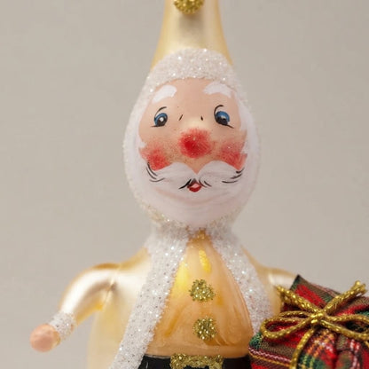 Babbo Natale oro con pacco regalo, decorazione di Natale dipinta a mano: dettaglio della decorazione