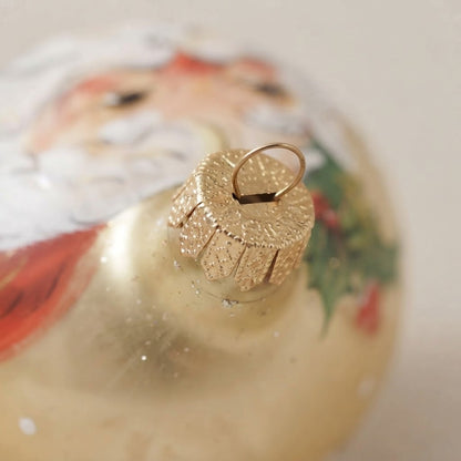 Lato e retro della palla di Natale in vetro soffiato