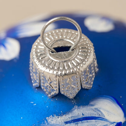White flower ball on blue