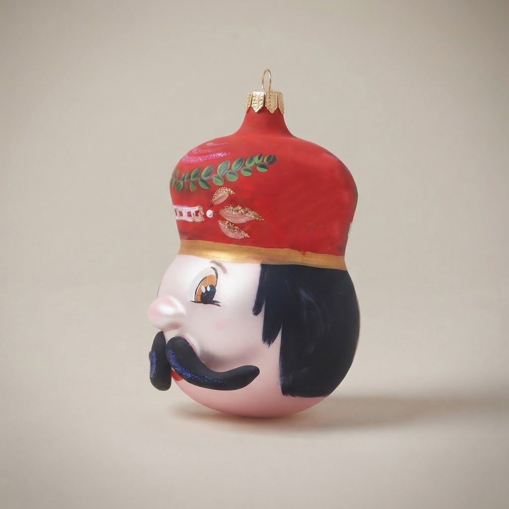 Red toy soldier head, hand-painted Christmas ornament: decoration detail