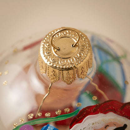 Lato e retro della palla di Natale in vetro soffiato