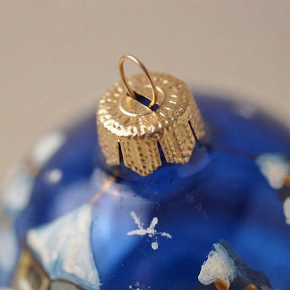 Lato e retro della palla di Natale in vetro soffiato