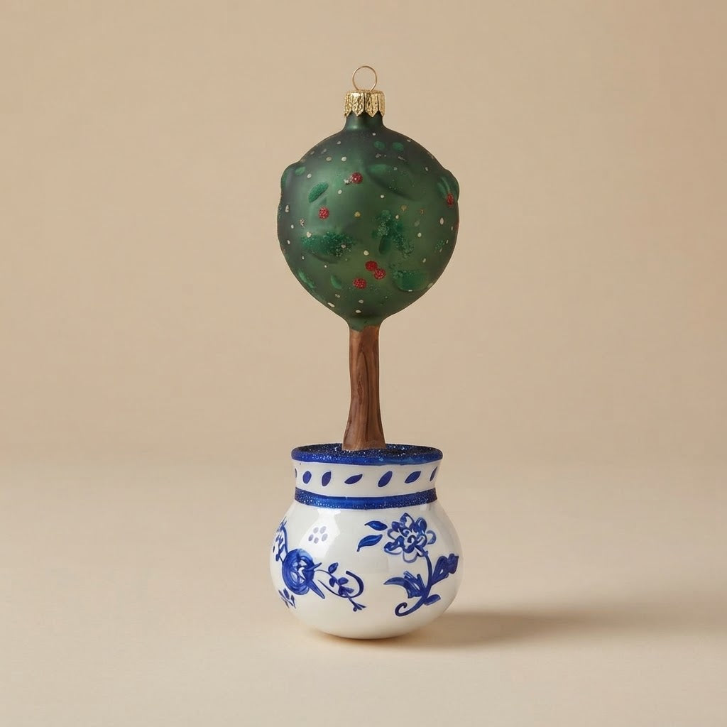 Glass topiary tree with green crown and hand-painted blue and white pot