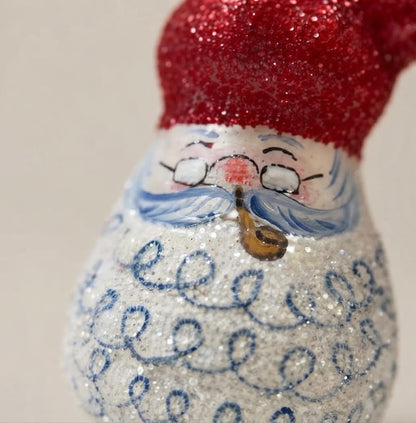 Close-up of Santa's face with glasses and pipe