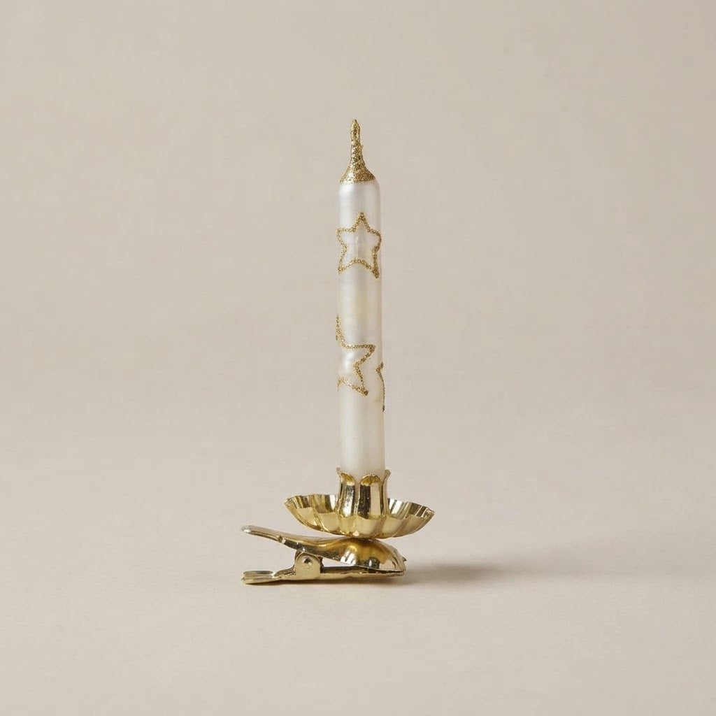 White Christmas candle with gold glitter stars on a gold clip