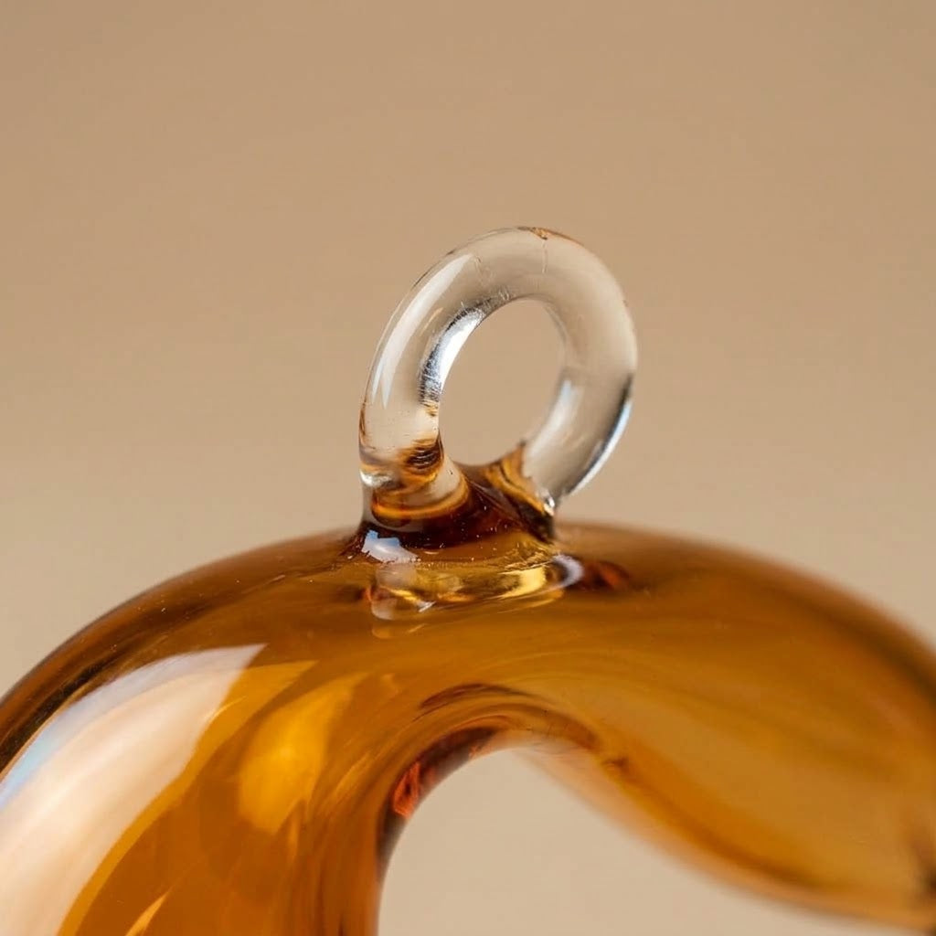 Clear glass hanging loop on the tip of the hat