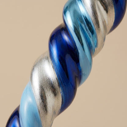 Detail of the blue, light blue and silver spiral on the mouth-blown glass icicle