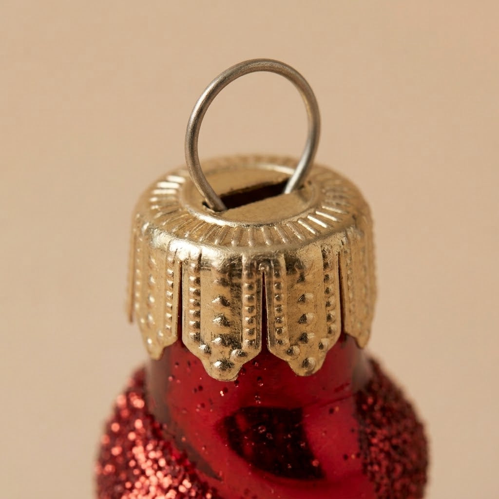 Cappuccio dorato del ghiacciolo di Natale rosso e bianco