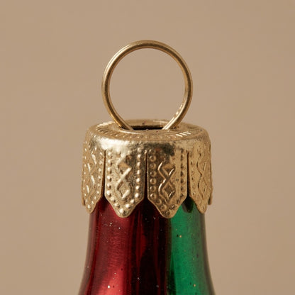 Cappuccio dorato del ghiacciolo di Natale verde, oro e rosso