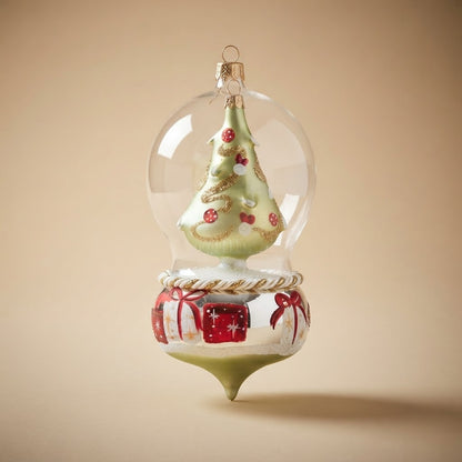 Giostra di Natale con albero nella bolla e regali – vista intera