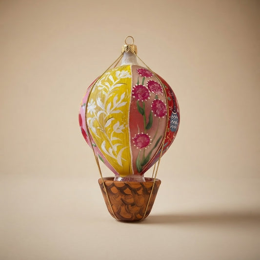 Hand-painted glass hot air balloon, yellow side with white branches and pink side with fuchsia flowers