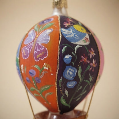 Close-up of the hand-painted lilac butterfly and light blue bird