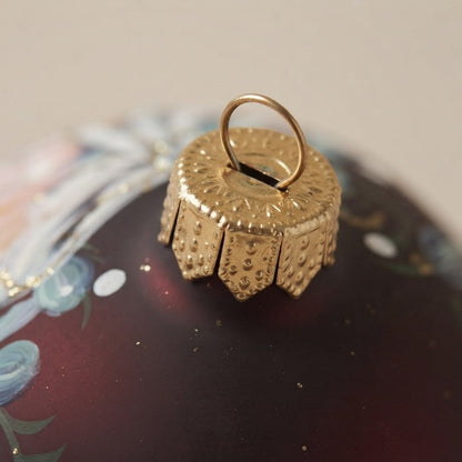 Detail of the mouth-blown, hand-painted glass Christmas ornament