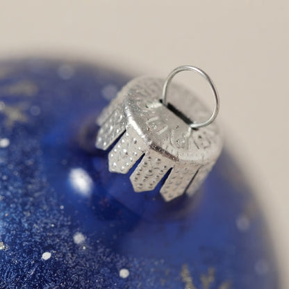 Close-up: Christmas ornament with a chickadee on blue, 4 in (10 cm)
