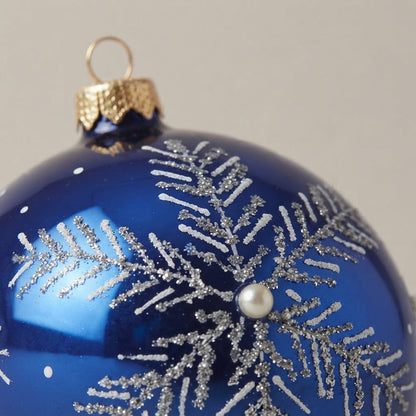 Detail of the mouth-blown, hand-painted glass Christmas ornament