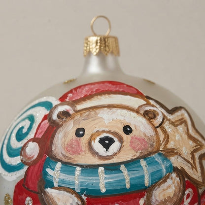 Close-up of the brush-painted decoration: Christmas ornament with teddy bear in a mug