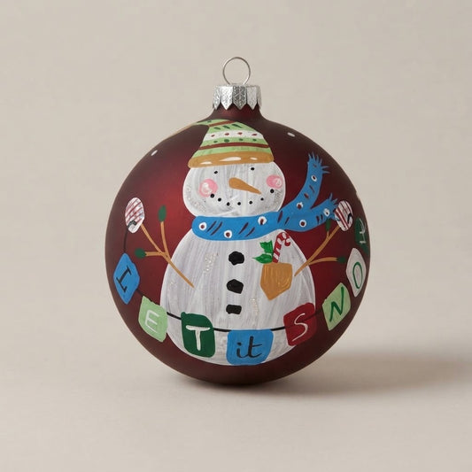 Hand-painted Christmas ornament, 4 in (10 cm): snowman and Let it snow lettering on a burgundy background