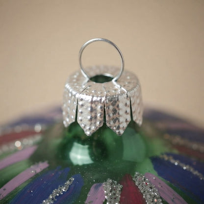 Detail of the mouth-blown, hand-painted glass Christmas ornament