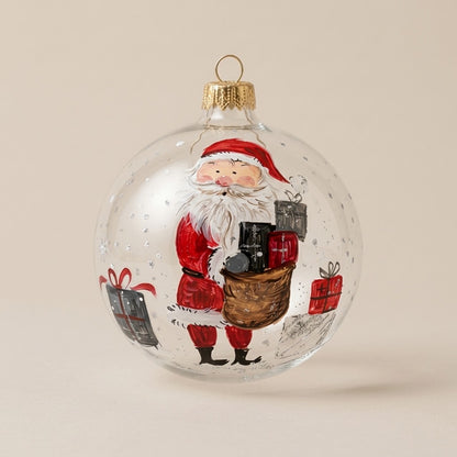 Palla di Natale Ø 10 cm dipinta a mano: Babbo Natale con il sacco dei regali su vetro trasparente