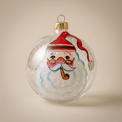 Palla di Natale Ø 10 cm dipinta a mano: volto di Babbo Natale con la pipa su vetro trasparente