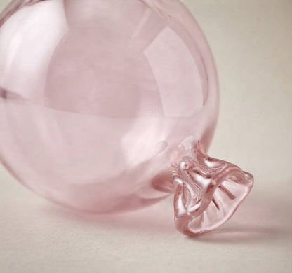 Light pink glass balloon ornament: close-up of the ruffled knot