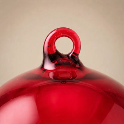 Red glass balloon ornament: close-up of the glass loop