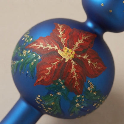 Dettaglio della stella di Natale rossa con glitter oro