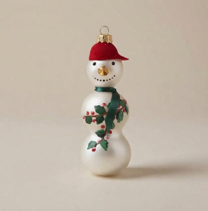 White glass snowman with red cap, green scarf and holly