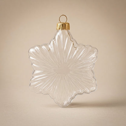 Six-pointed clear glass star ornament with gold cap