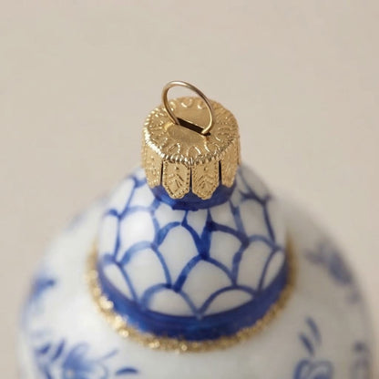 Close-up of the blue-scaled neck and gold-tone cap