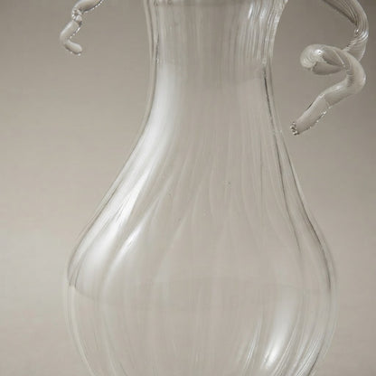 Close-up of the ribs and tendrils of the clear glass pear-shaped pumpkin