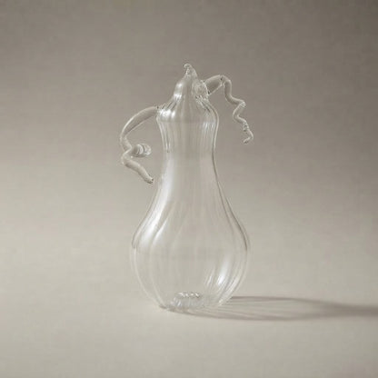 Clear glass pear-shaped pumpkin seen from the other side