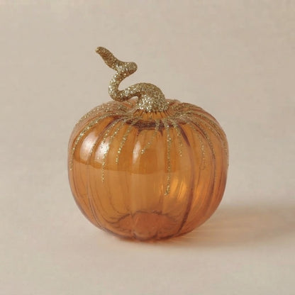 Zucca in vetro ambra con picciolo arricciato e righe in glitter oro